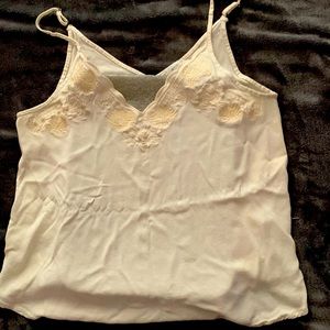 Eggshell white with cream floral detail on lining of chest.
